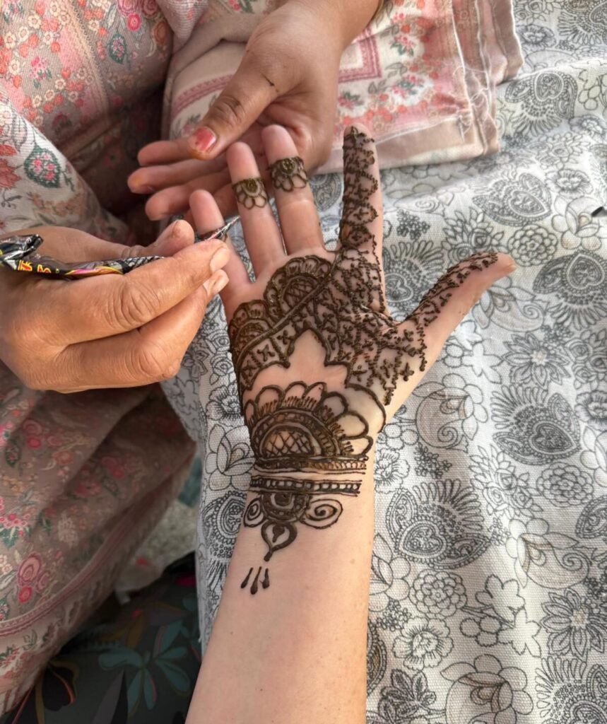 Traditional Indian henna mehndi design on a hand at Om Homestay in Rishikesh