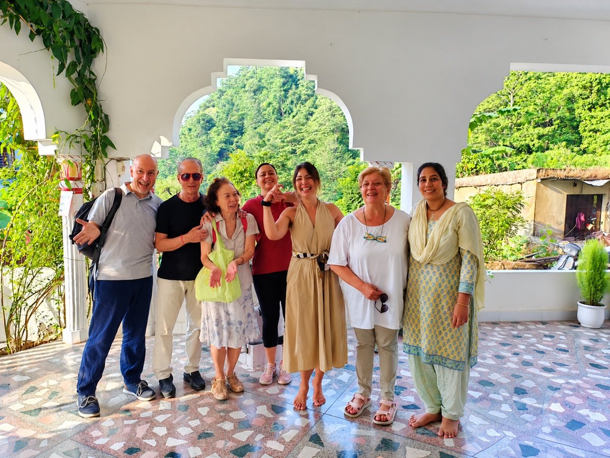 Guests sharing a warm welcome at Om Homestay in Rishikesh